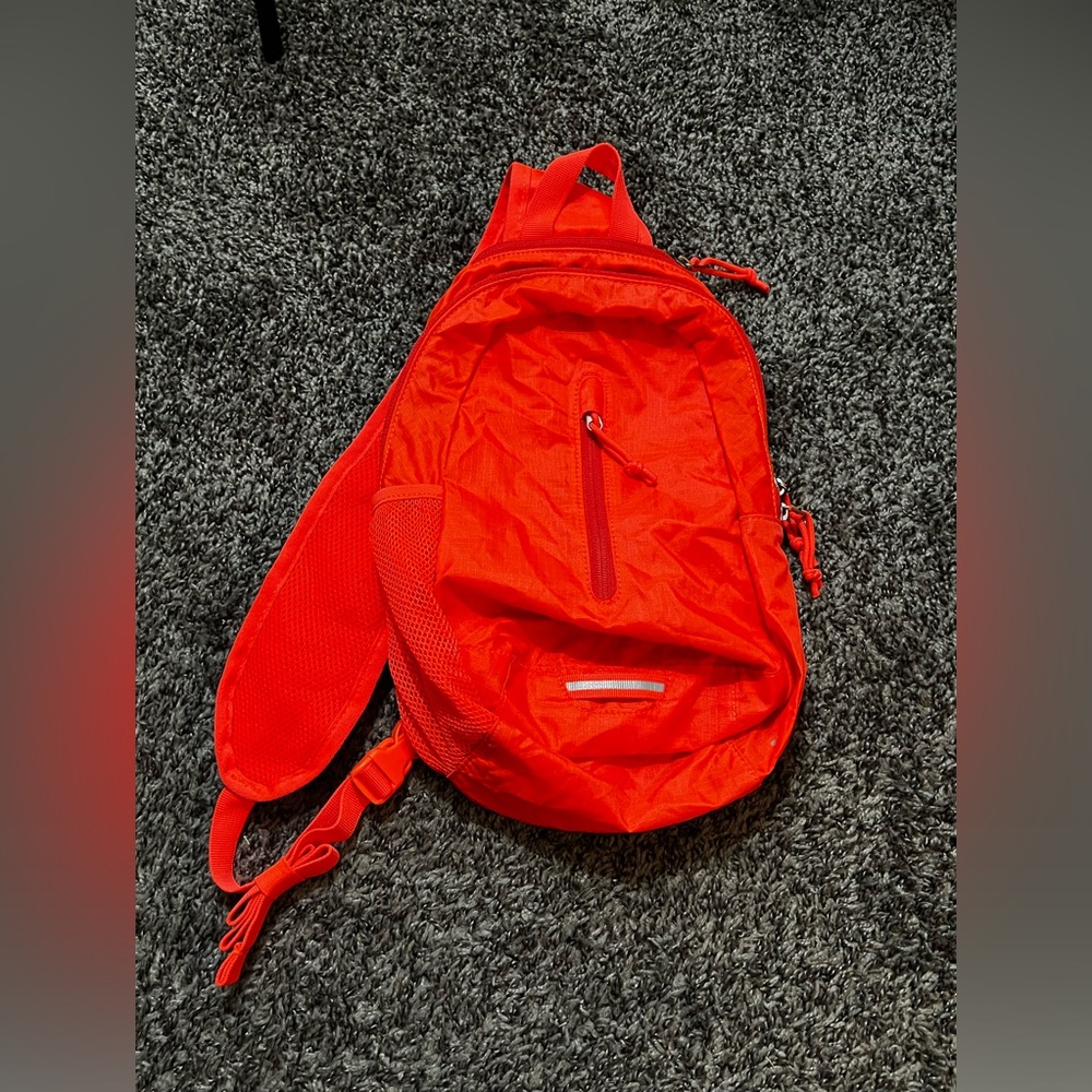 Bright orange sling.
